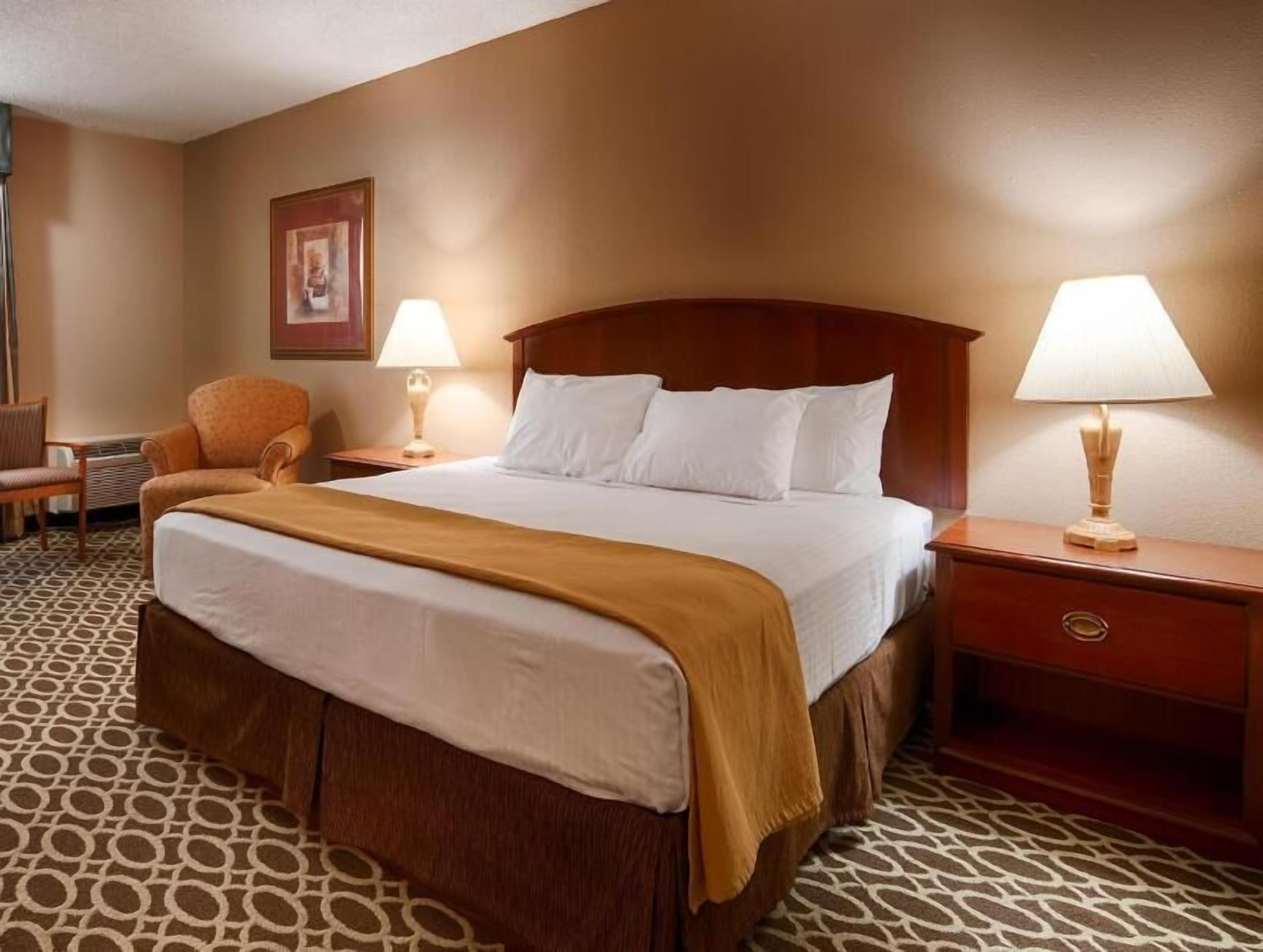 Premium bedding, desk, laptop workspace, iron/ironing board