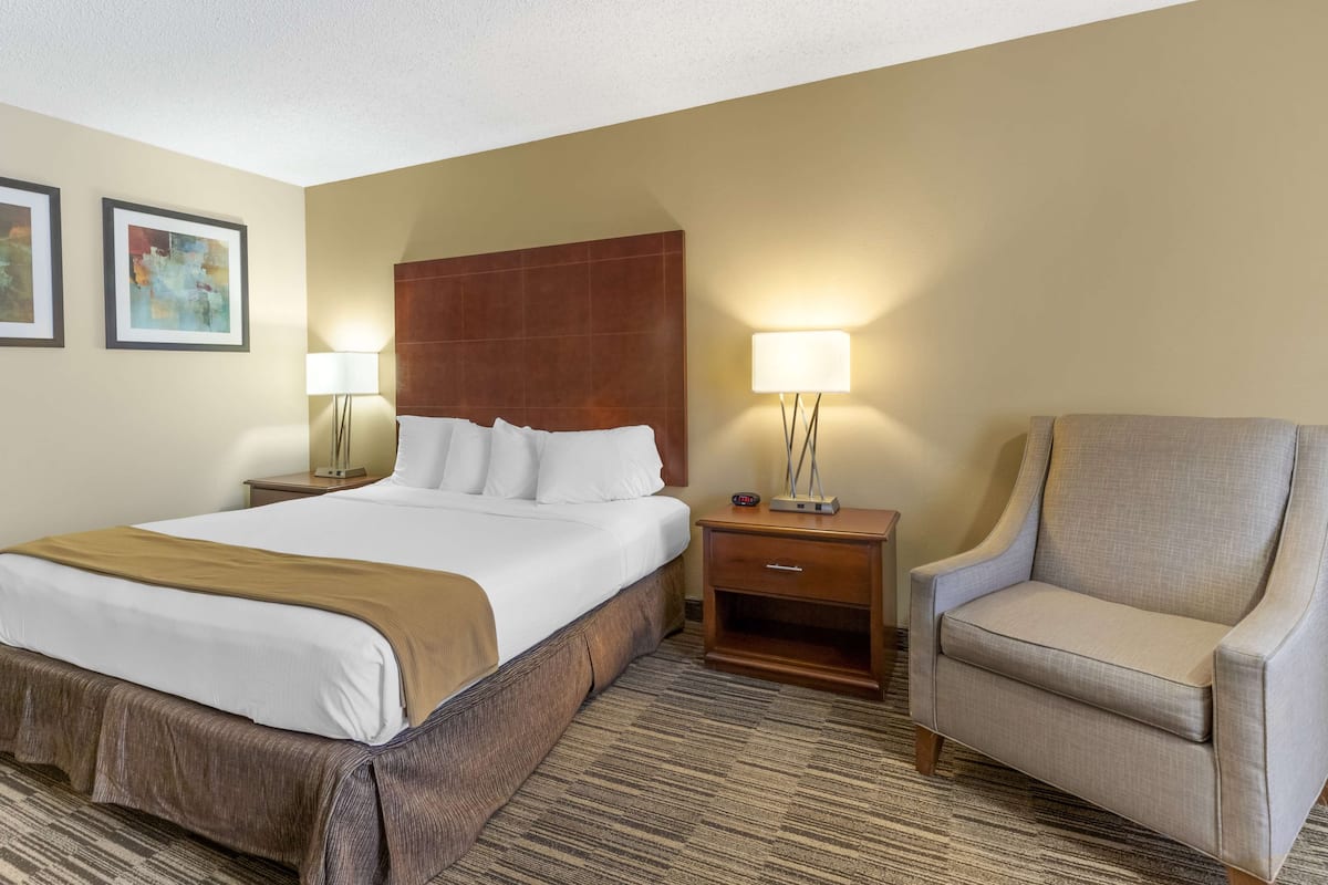 Premium bedding, desk, laptop workspace, iron/ironing board