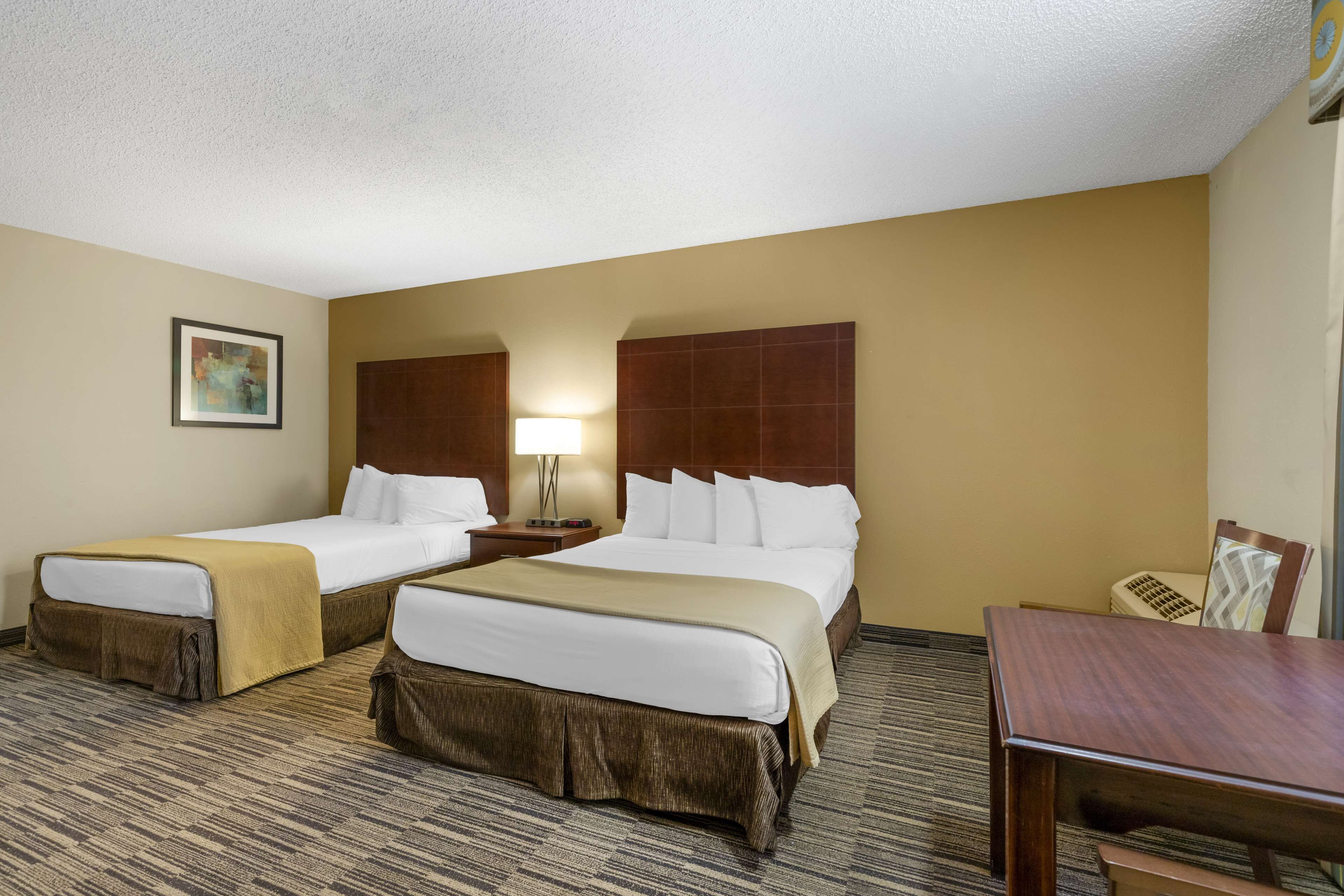 Premium bedding, desk, laptop workspace, iron/ironing board