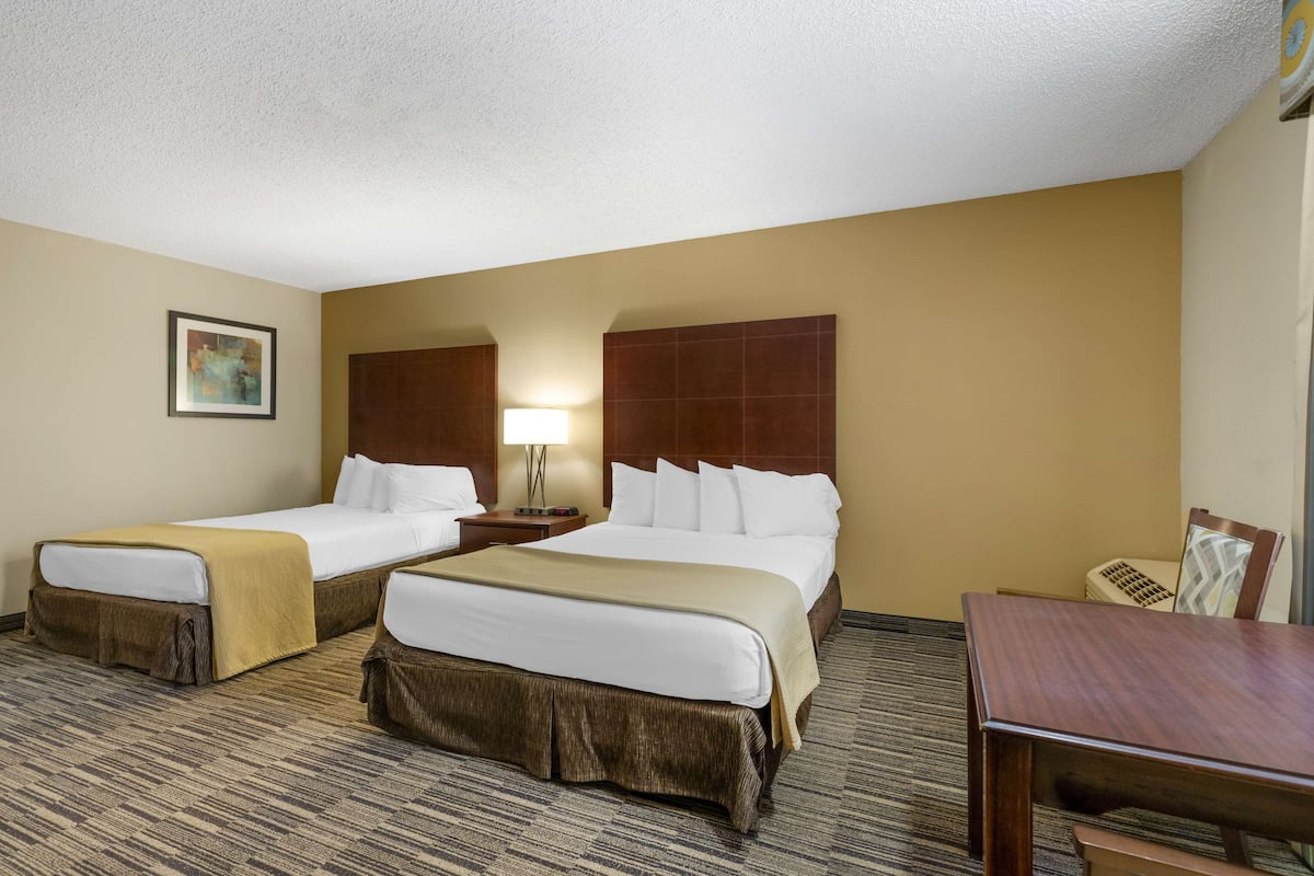 Premium bedding, desk, laptop workspace, iron/ironing board