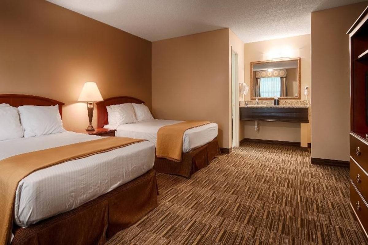 Premium bedding, desk, laptop workspace, iron/ironing board