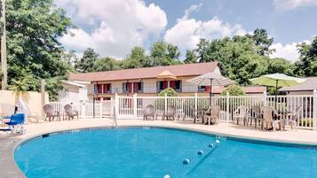 Seasonal outdoor pool, open noon to 9:00 PM, pool umbrellas