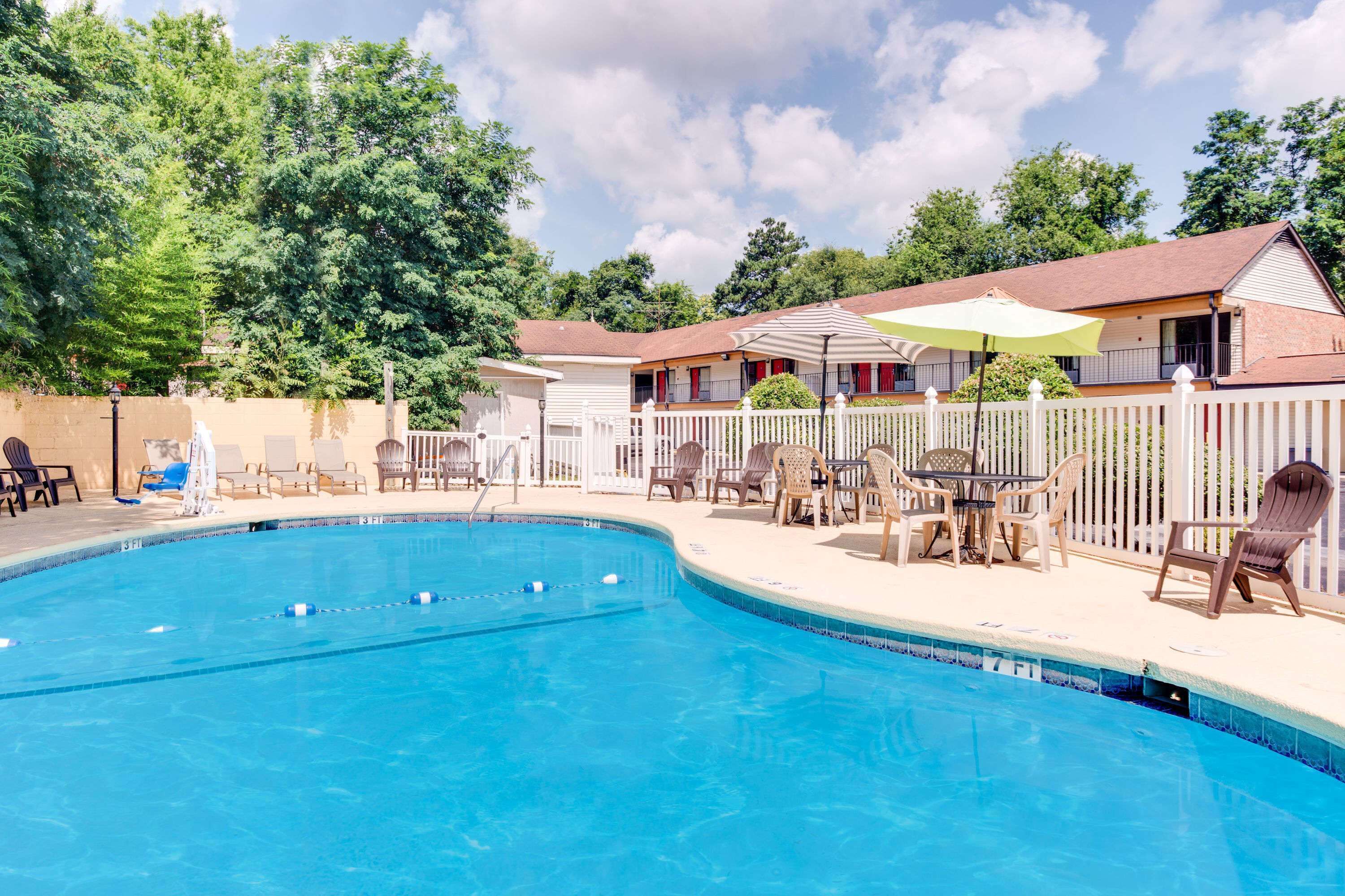 Seasonal outdoor pool, open noon to 9:00 PM, pool umbrellas