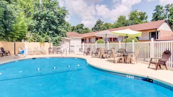 Seasonal outdoor pool, open noon to 9:00 PM, pool umbrellas