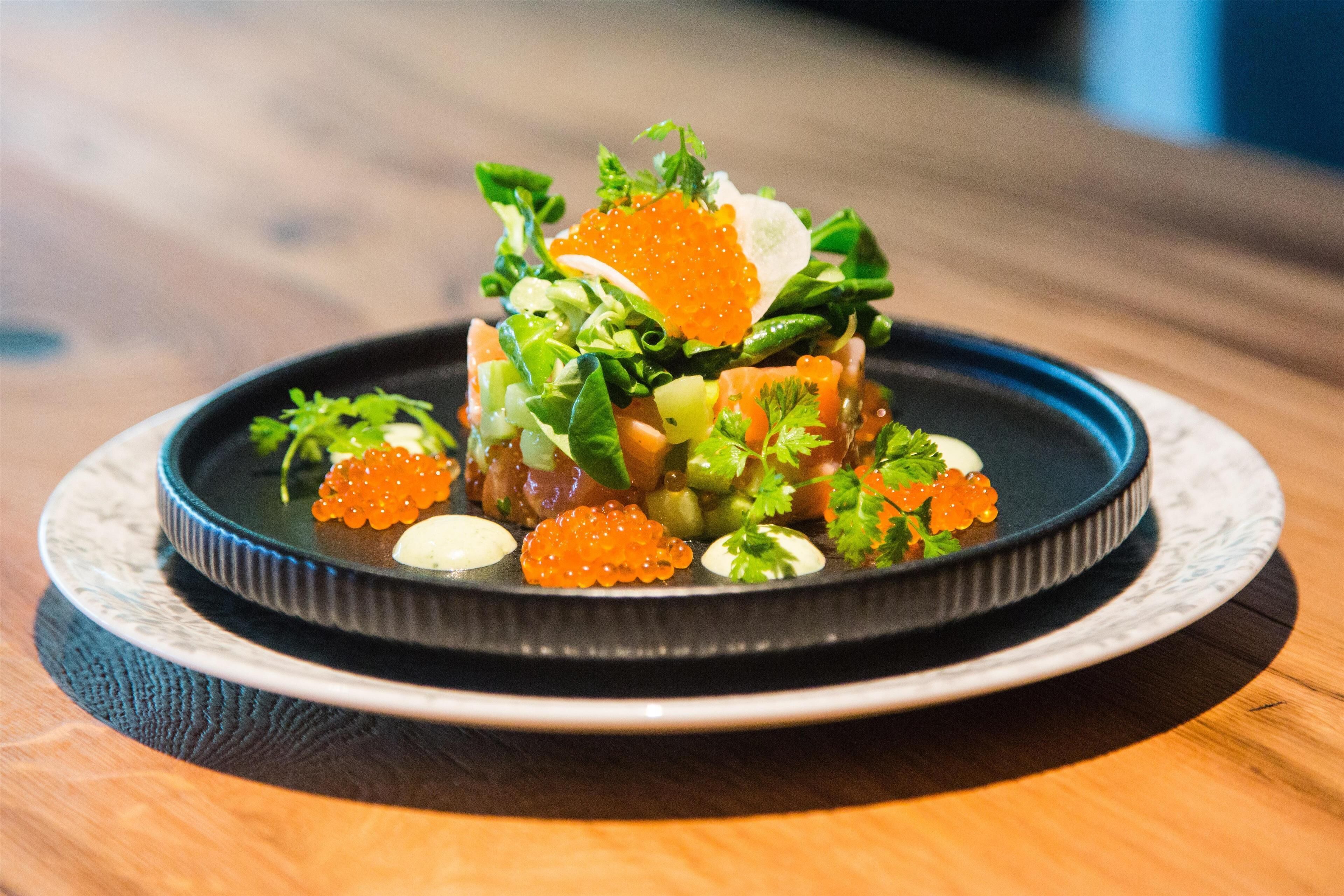 A dish with various ingredients on a plate.