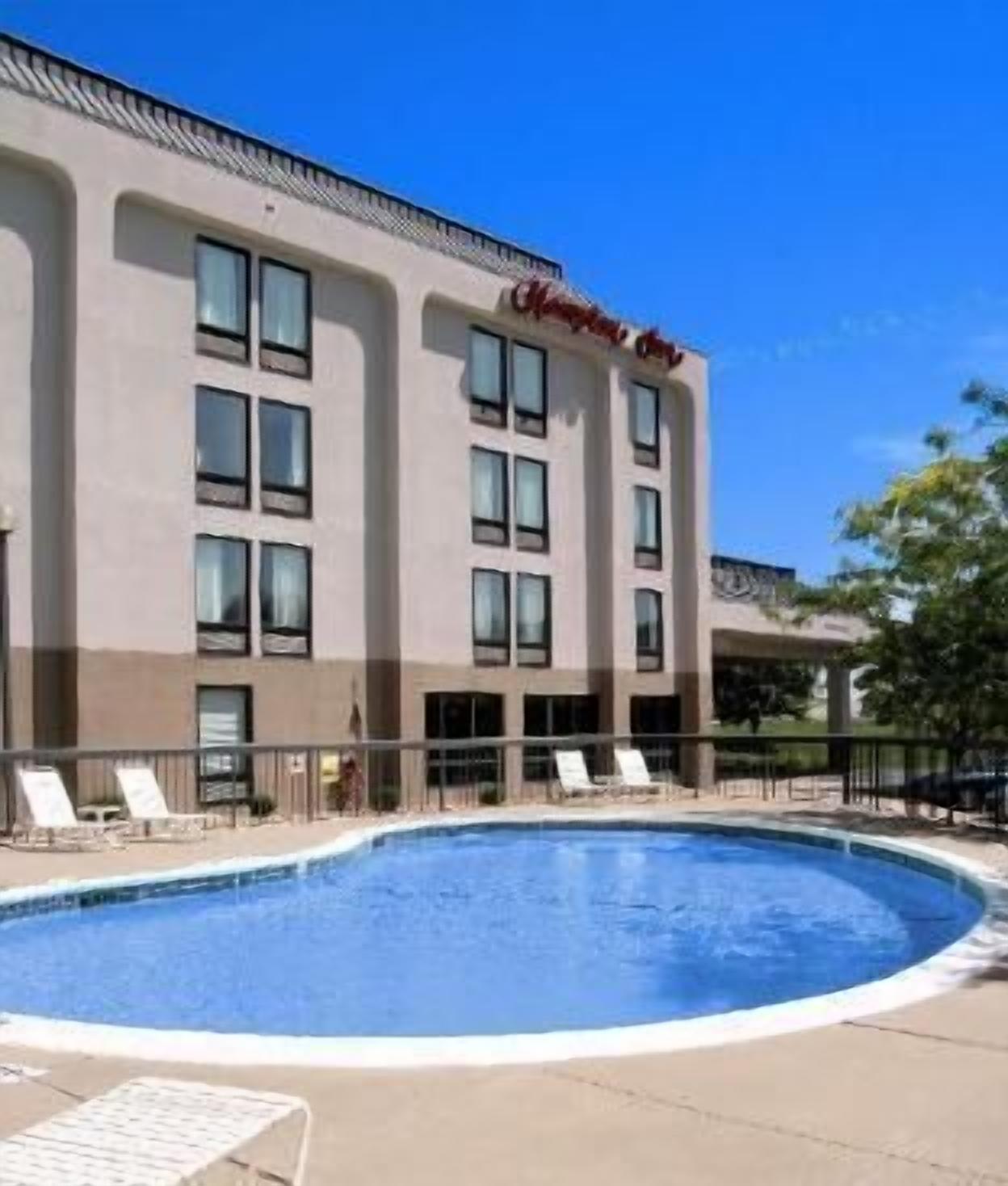 Seasonal outdoor pool, open 10:00 AM to 9:00 PM, pool umbrellas