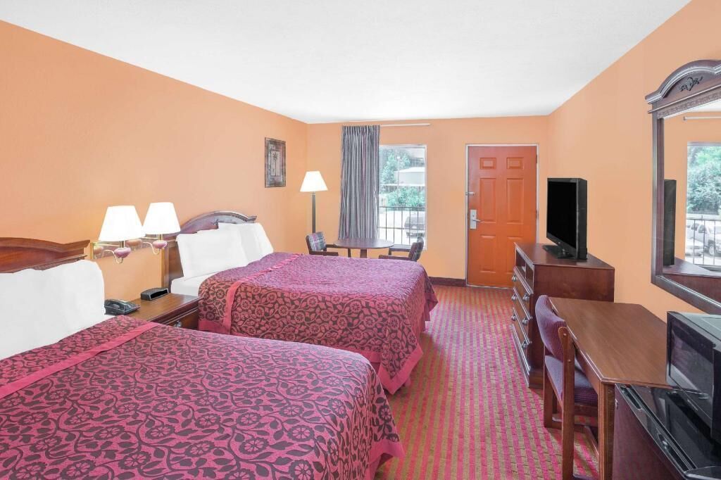 Premium bedding, desk, laptop workspace, blackout drapes