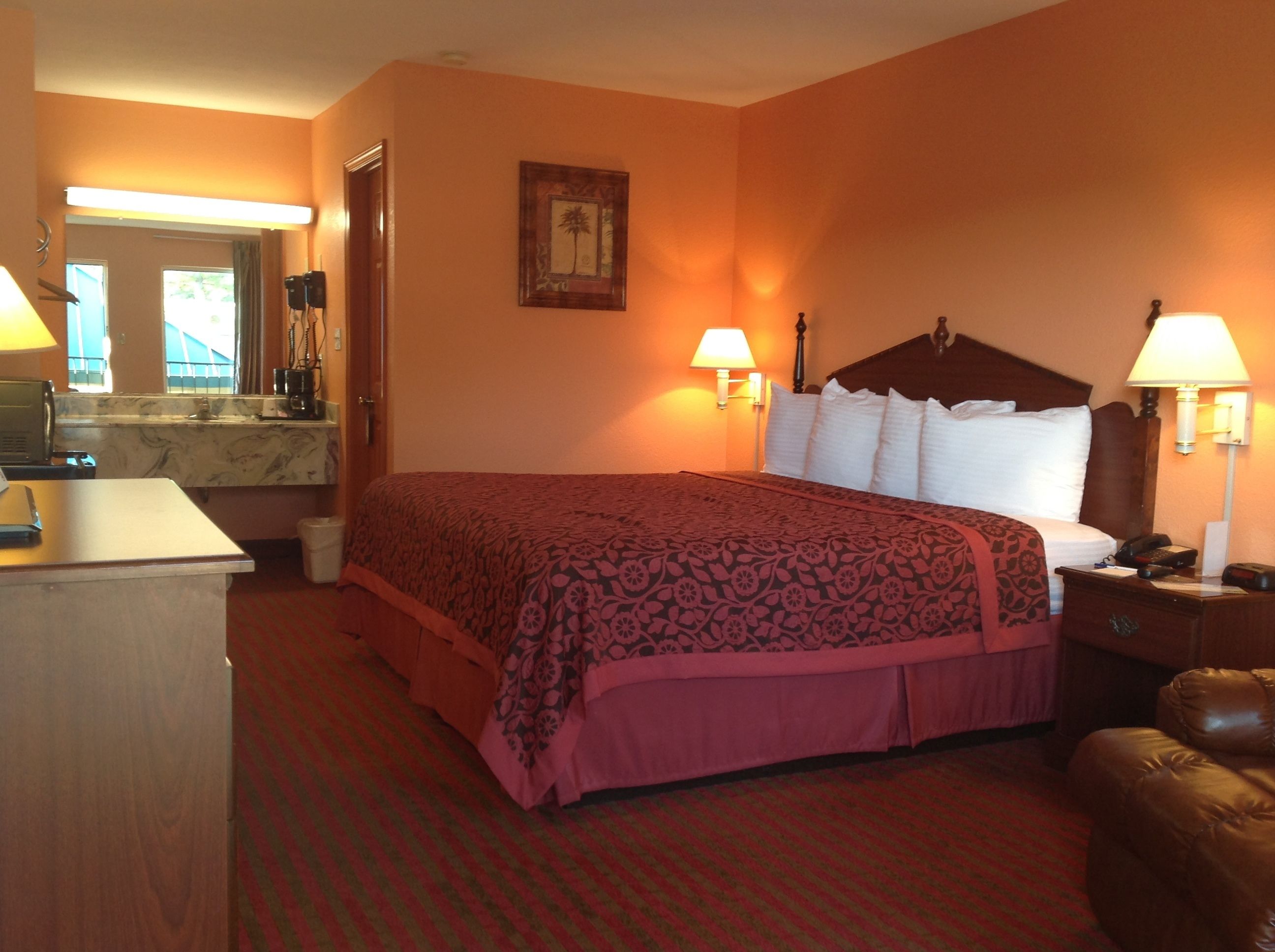 Premium bedding, desk, laptop workspace, blackout drapes