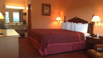 Premium bedding, desk, laptop workspace, blackout drapes