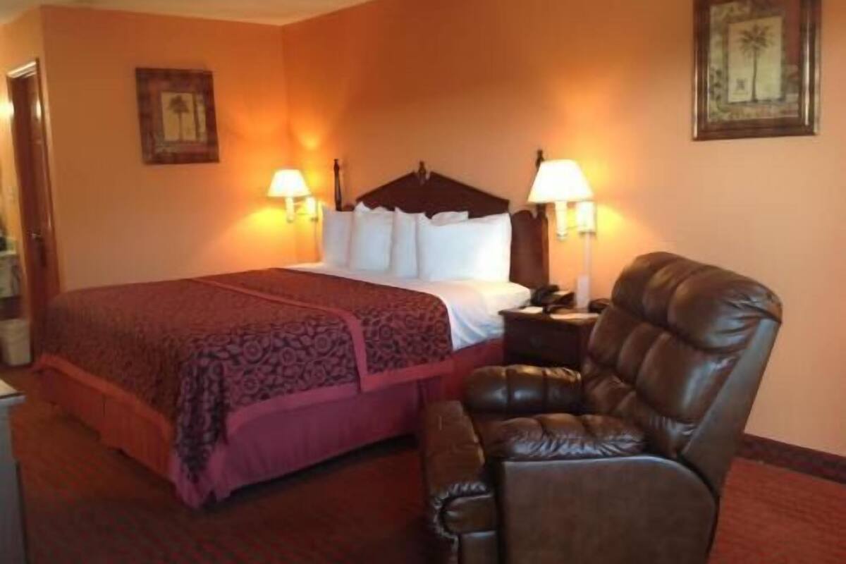 Premium bedding, desk, laptop workspace, blackout drapes