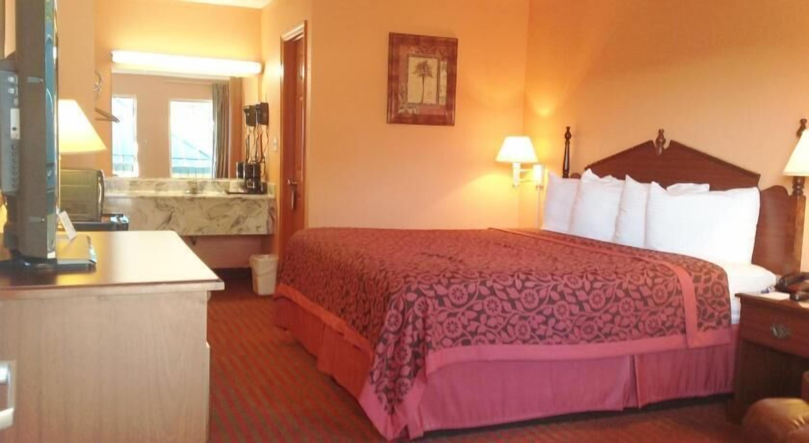 Premium bedding, desk, laptop workspace, blackout drapes