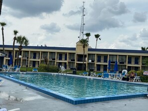 Outdoor pool, pool umbrellas, sun loungers