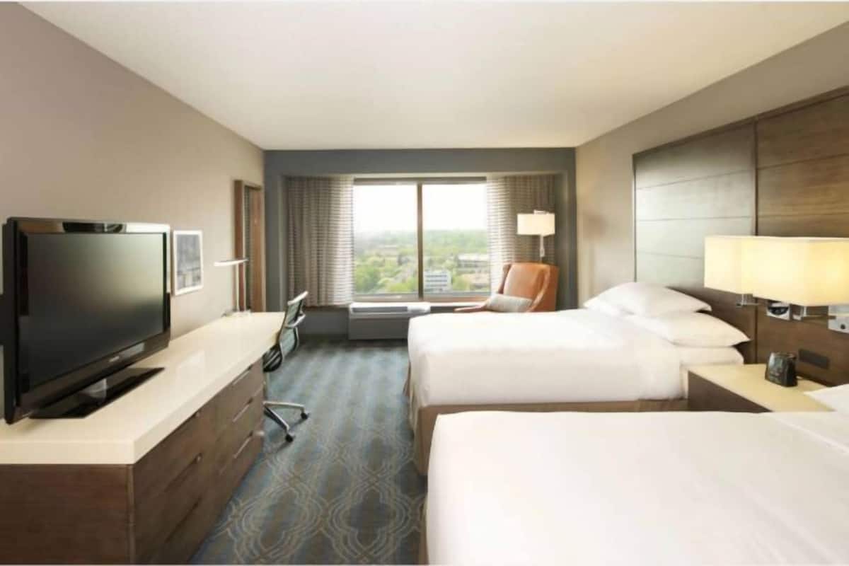 Premium bedding, desk, laptop workspace, iron/ironing board