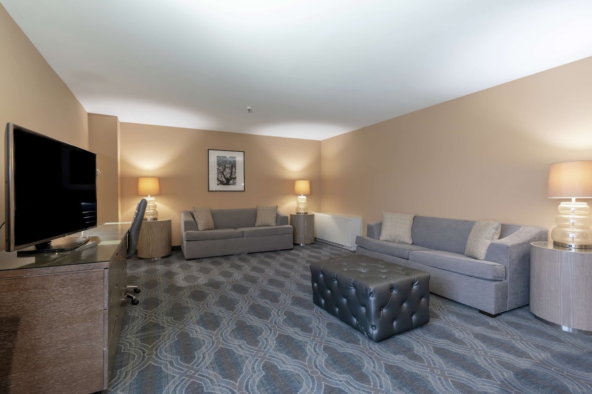 Premium bedding, desk, laptop workspace, iron/ironing board
