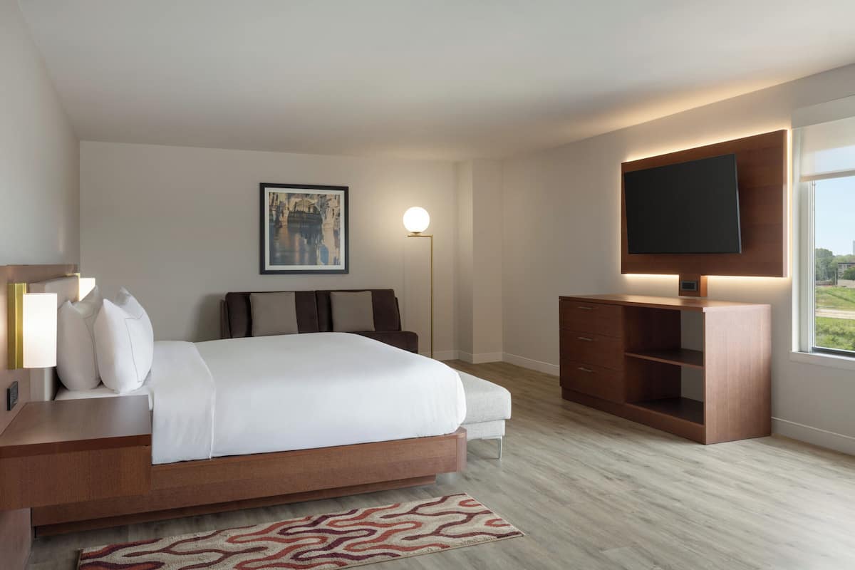 Premium bedding, desk, laptop workspace, iron/ironing board