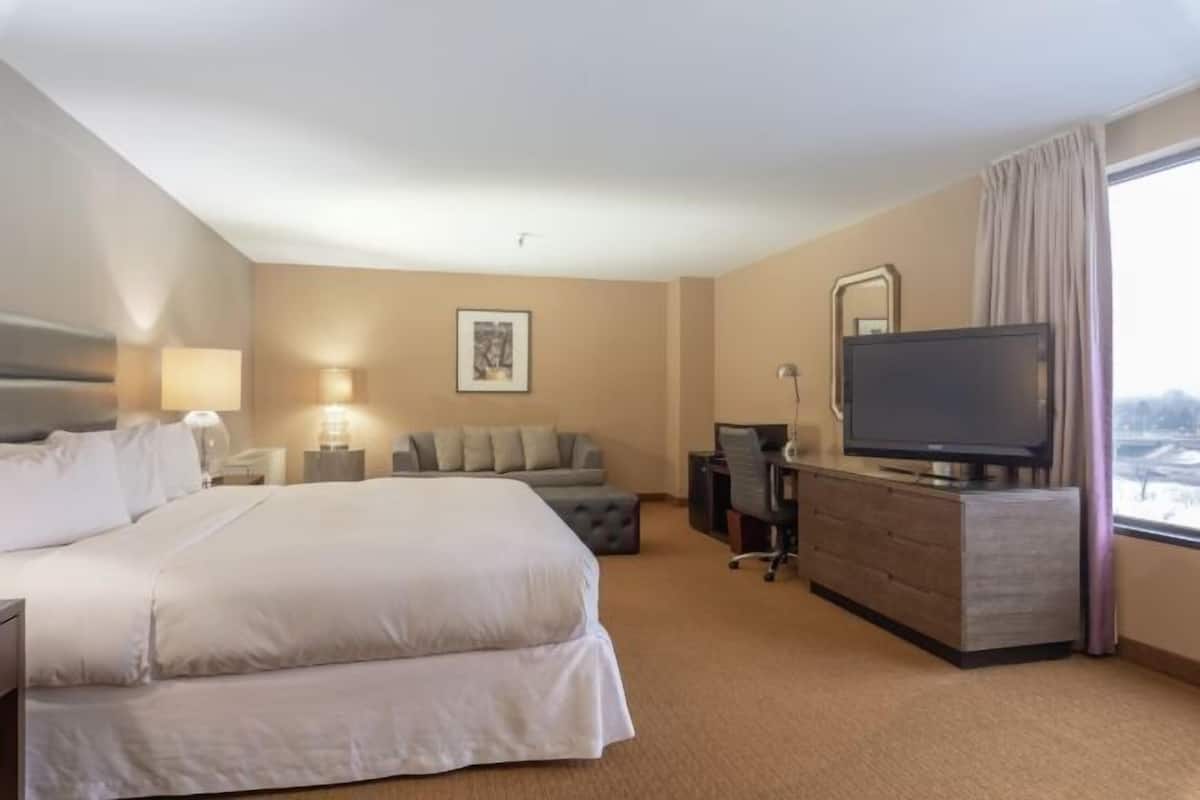 Premium bedding, desk, laptop workspace, iron/ironing board