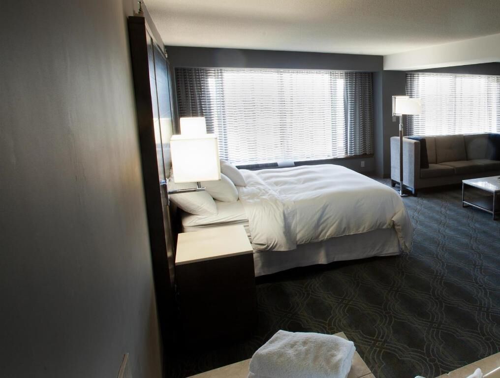 Premium bedding, desk, laptop workspace, iron/ironing board