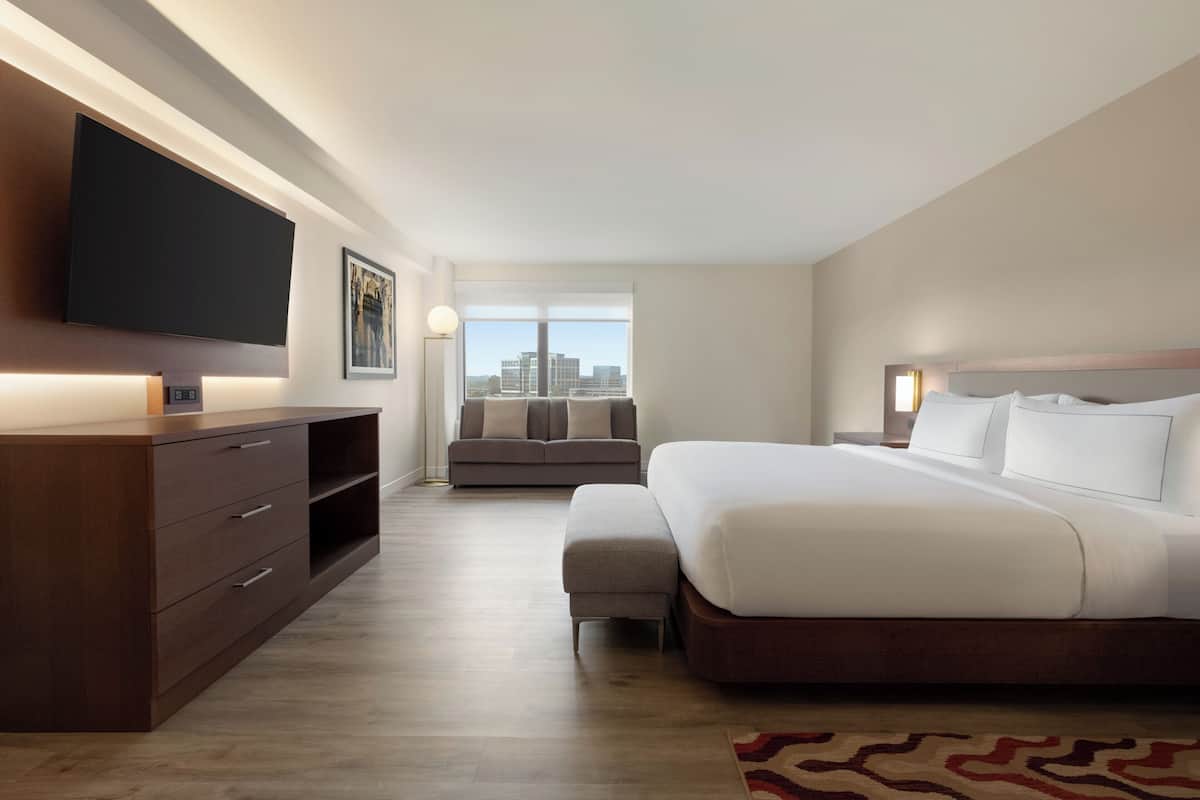 Premium bedding, desk, laptop workspace, iron/ironing board