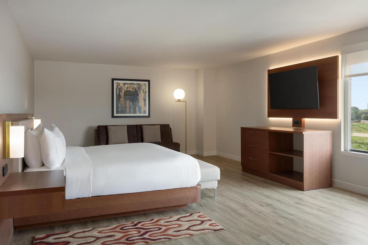 Premium bedding, desk, laptop workspace, iron/ironing board