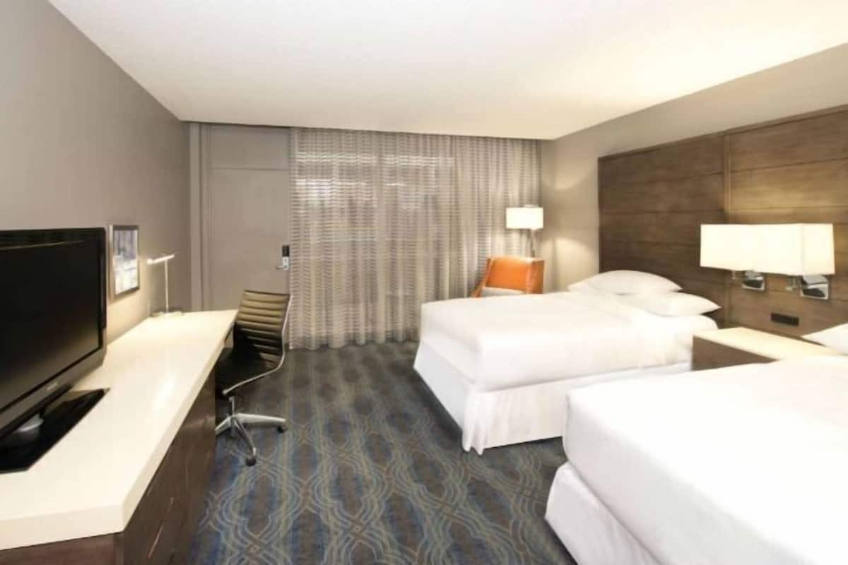 Premium bedding, desk, laptop workspace, iron/ironing board