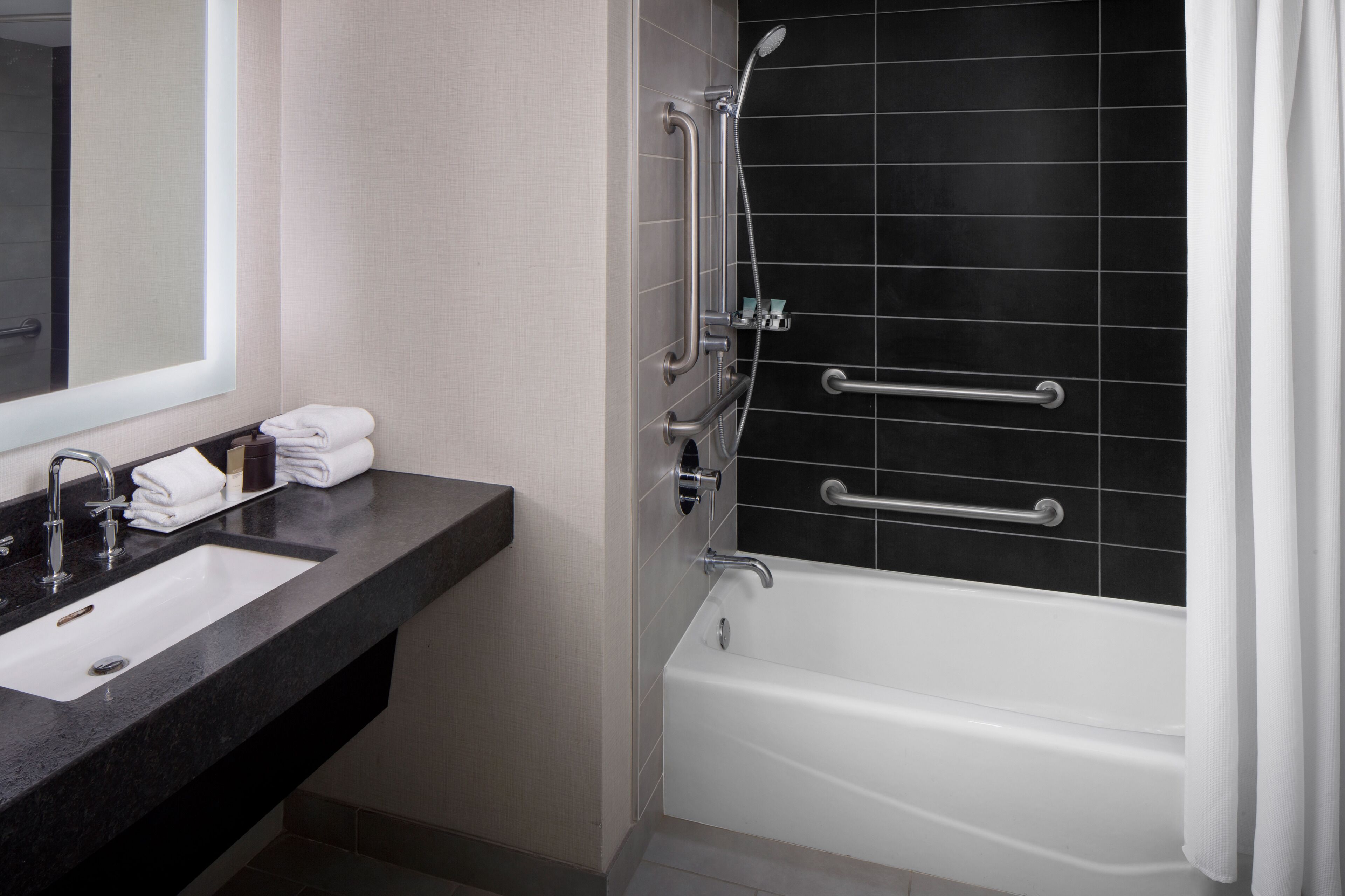 designer toiletries, hair dryer, towels, soap