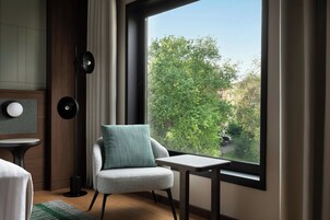 Premium bedding, down comforters, minibar, in-room safe