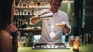 A bartender pouring a drink into a glass. - Ace Hotel & Swim Club Palm Springs (Palm Springs)