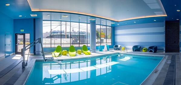 Indoor pool, open 9:00 AM to midnight, pool loungers