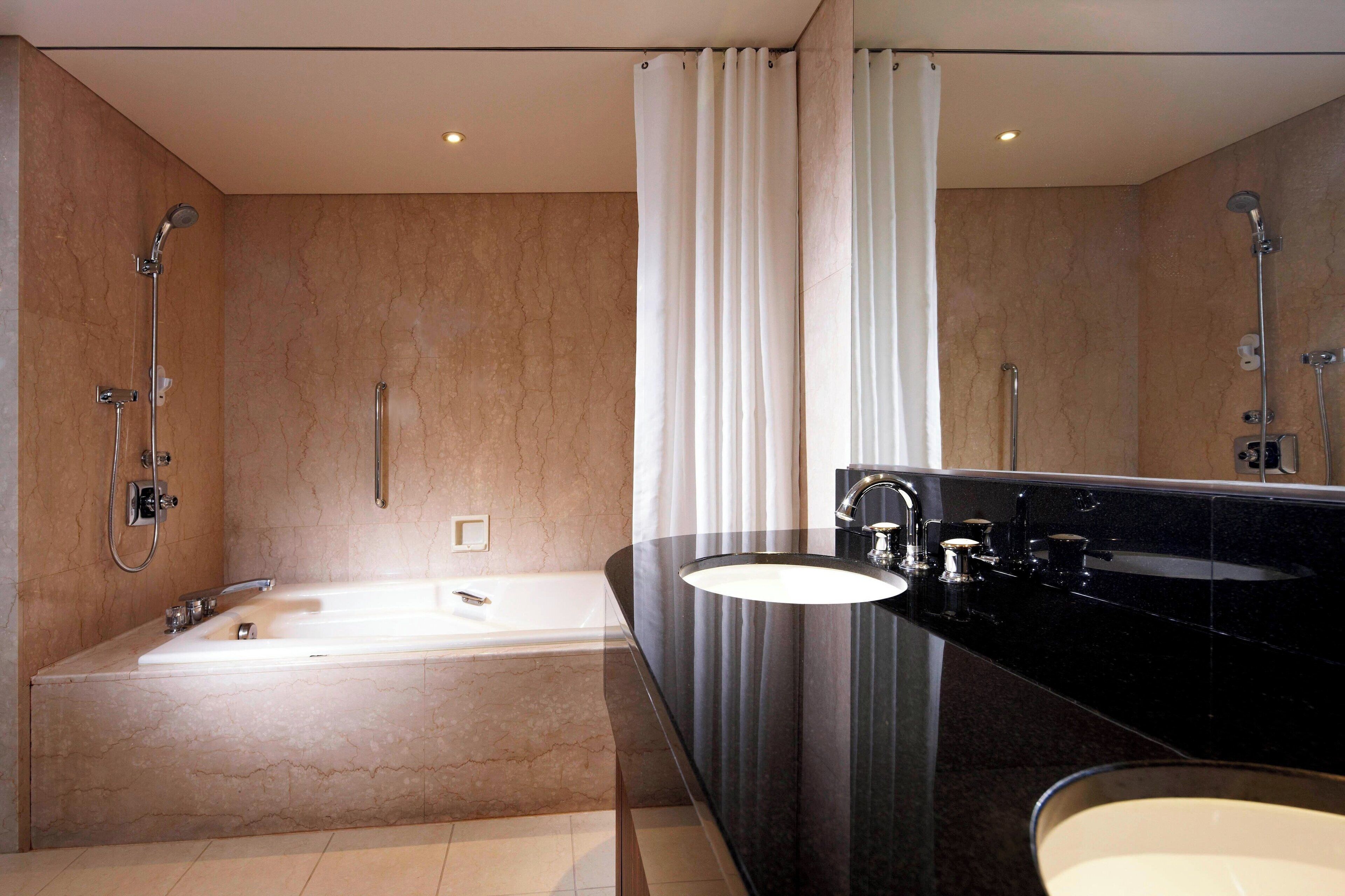 combined shower/bathtub, deep-soaking bathtub, free toiletries