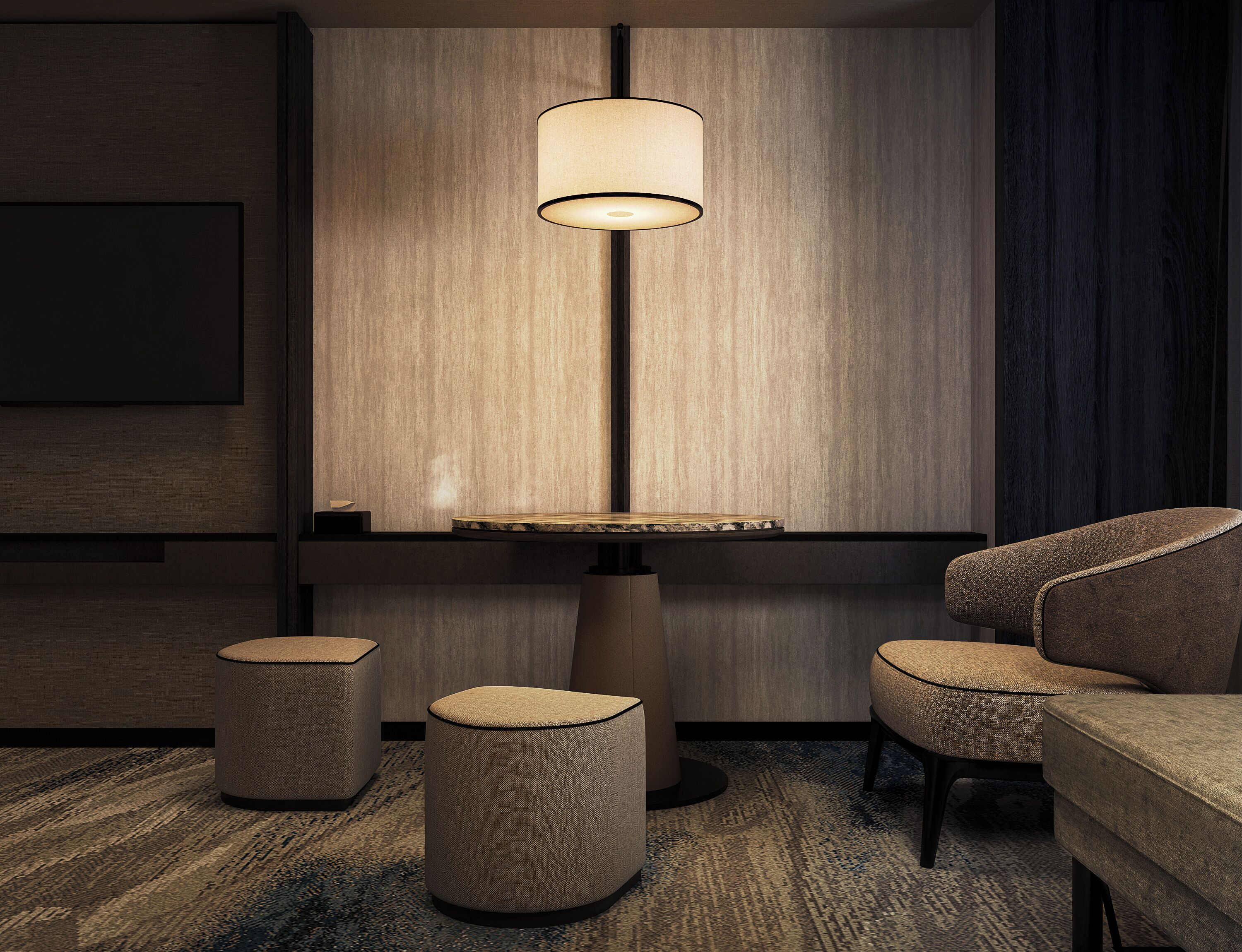 Une pièce moderne avec une table ronde, deux poufs, un canapé et une lampe suspendue.