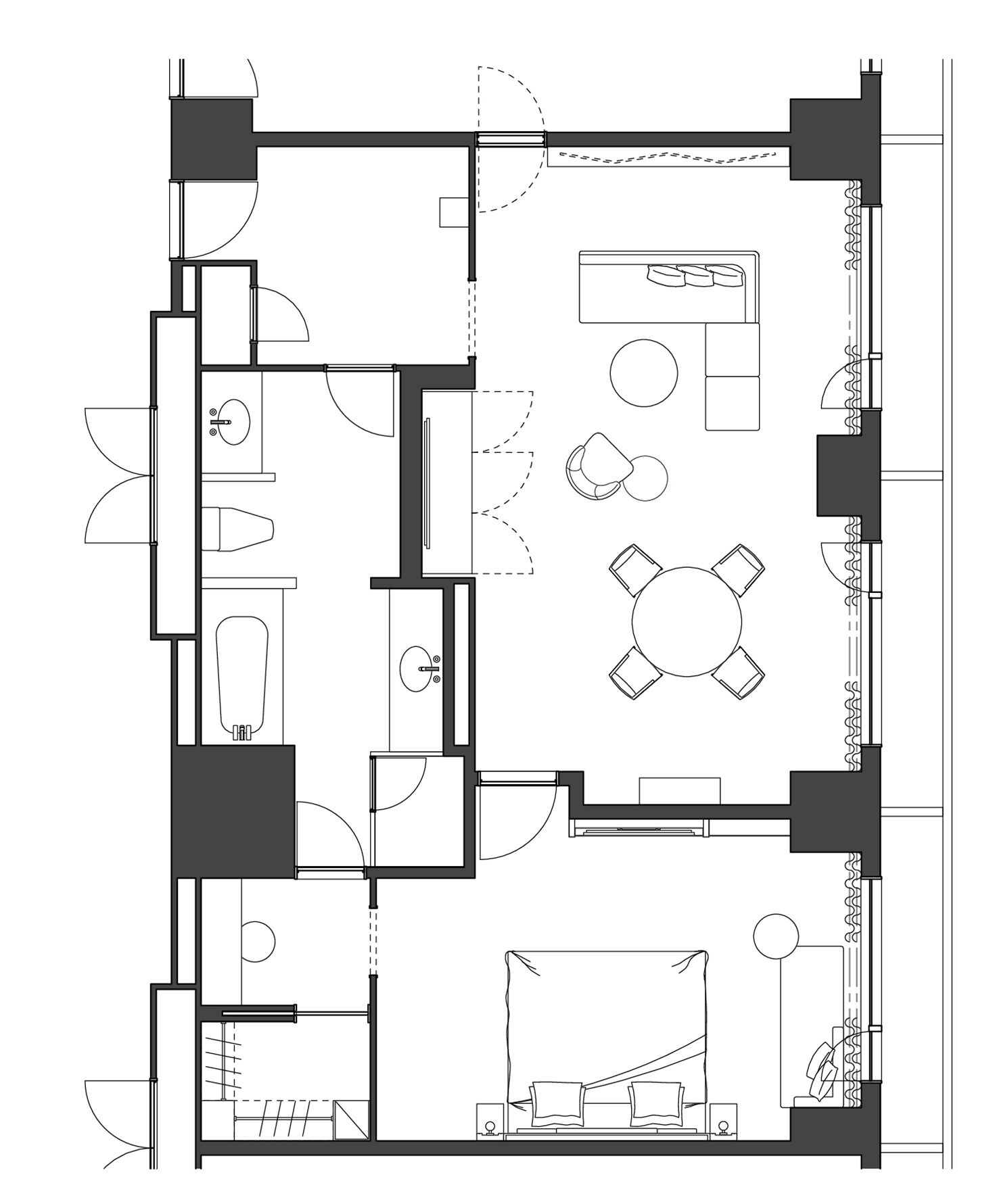 A floor plan of a hotel with a central dining area, multiple bedrooms, and a bathroom.