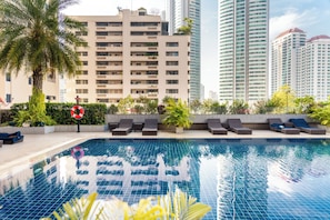 Outdoor pool, open 7:00 AM to 9:00 PM, pool umbrellas