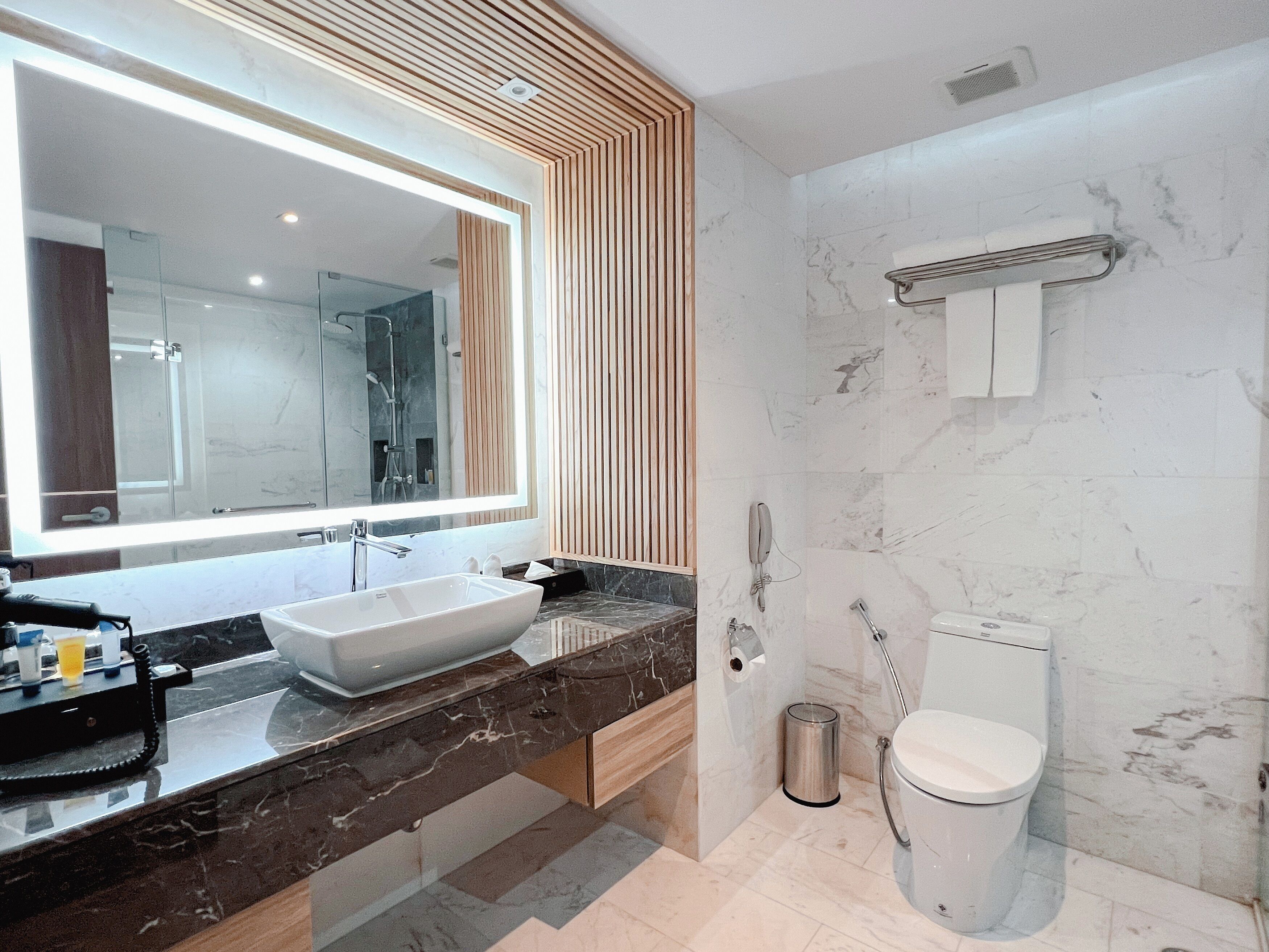 premier king bed | bathroom | eco-friendly toiletries, hair dryer, towels, soap