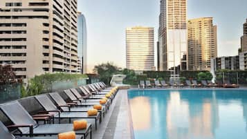 Outdoor pool, open 7:00 AM to 9:00 PM, pool umbrellas