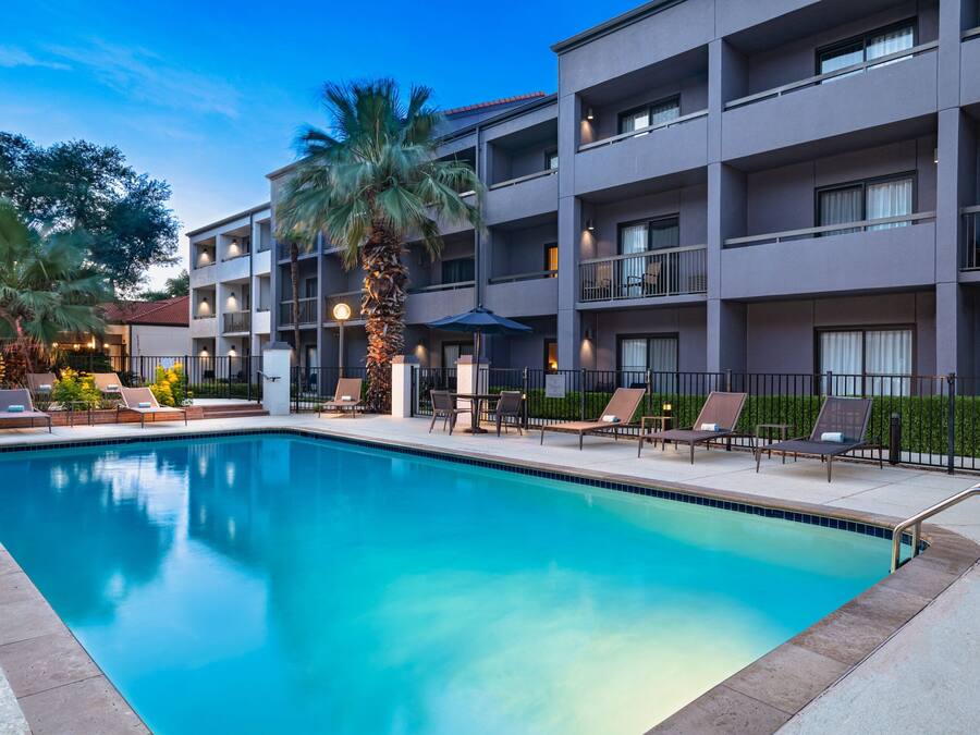 Outdoor pool, open 6:00 AM to 11:00 PM, pool umbrellas, pool loungers