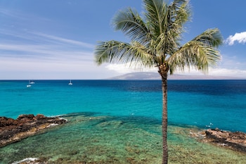 In-room safe, desk, blackout drapes, iron/ironing board at Sheraton Maui Resort & Spa