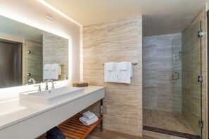 Shower, designer toiletries, hair dryer, towels