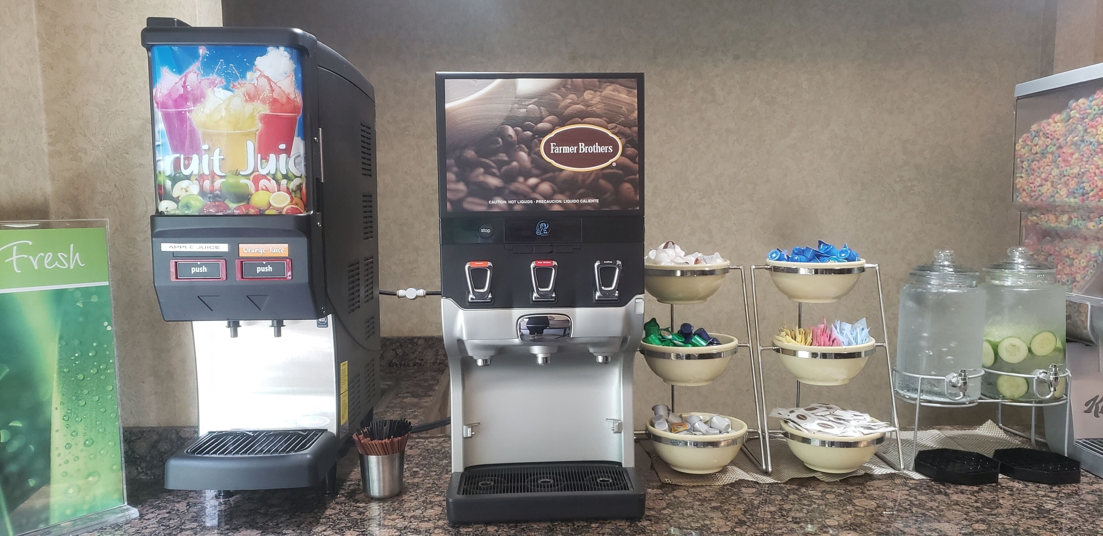 A coffee machine with a Fruit Juice dispenser and a Farmer Brothers coffee station.
