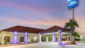 A hotel with a red roof, a covered entrance, and a sign reading "Best Western." - Best Western near Lackland AFB/SeaWorld (San Antonio)