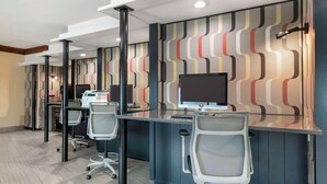 A modern office space with desks, chairs, and computers. - Best Western Plus Kansas City Sports Complex Hotel (Kansas City)