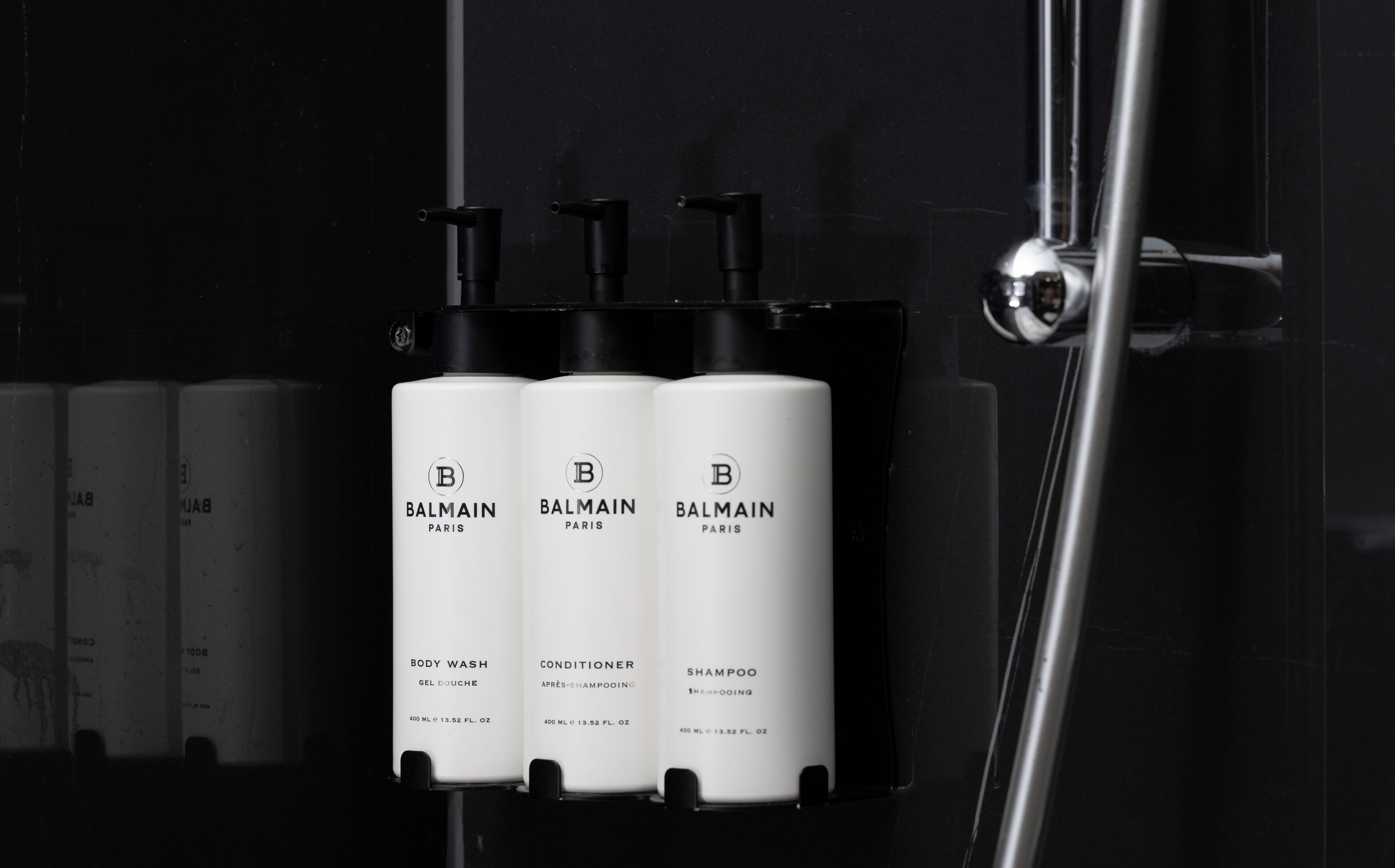 Three Balmain Paris products in a black holder.