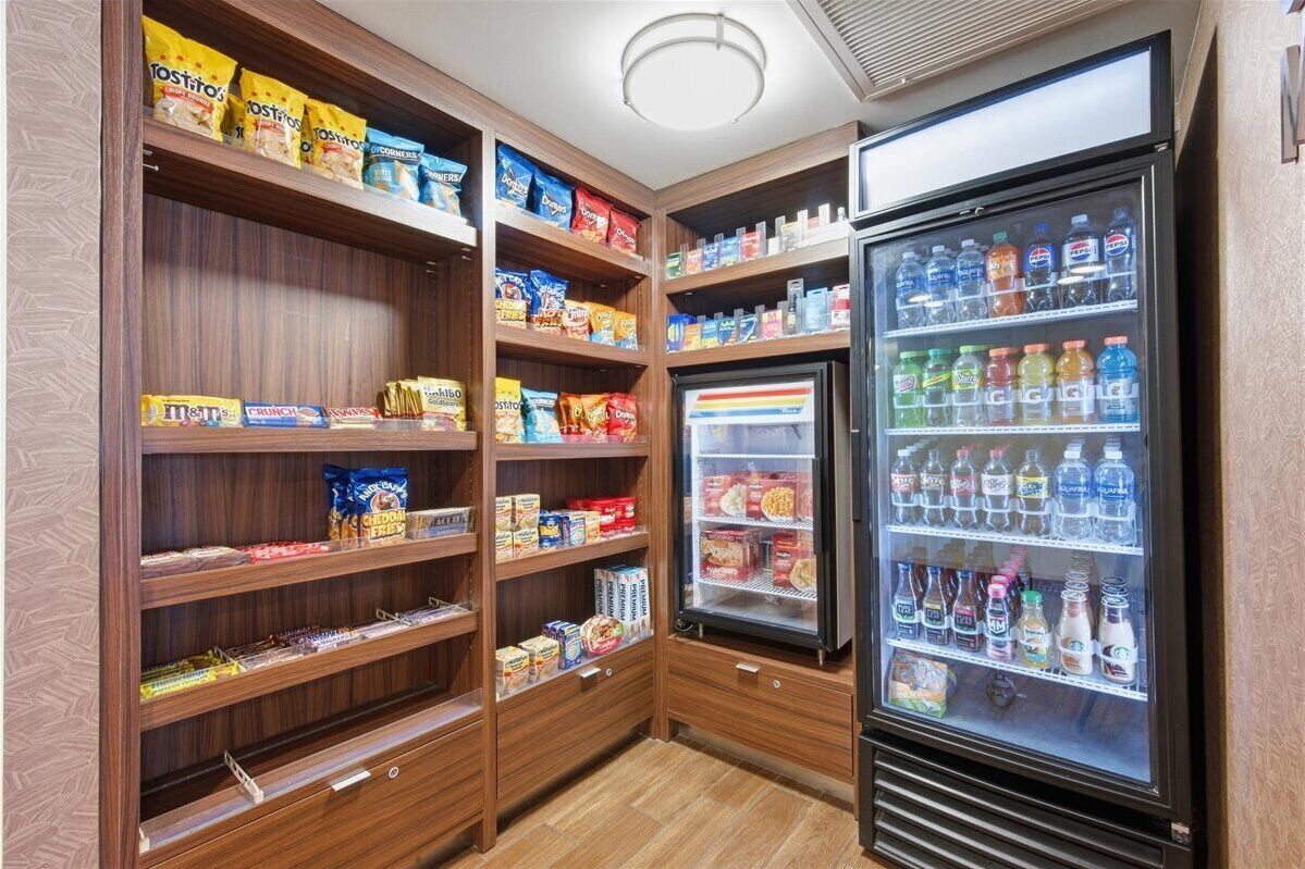 A snack and beverage vending area with various snacks and drinks.