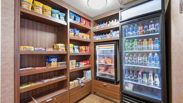 A snack and beverage vending area with various snacks and drinks.
