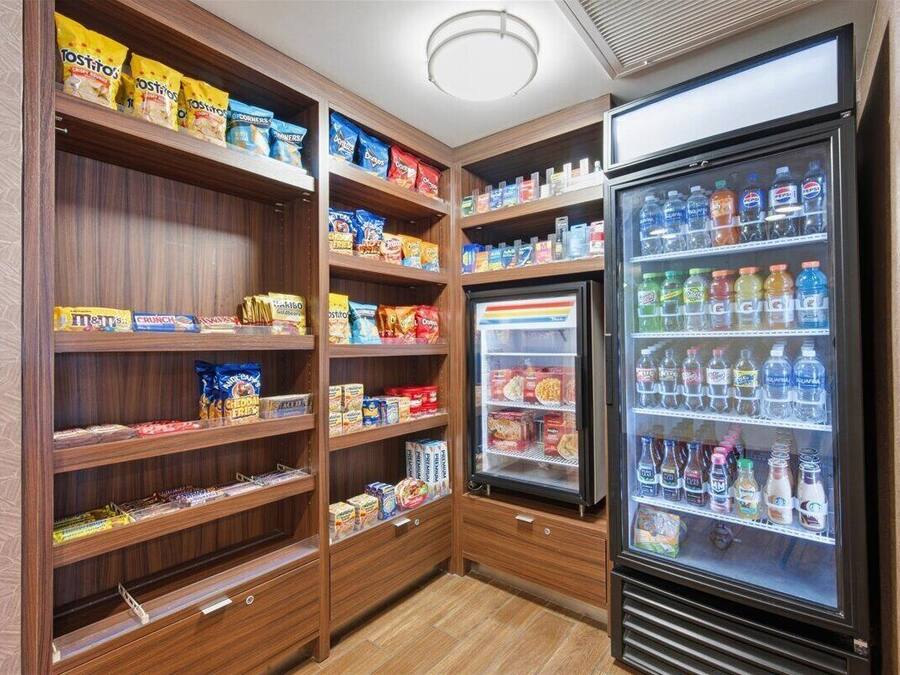 A snack and beverage vending area with various snacks and drinks.