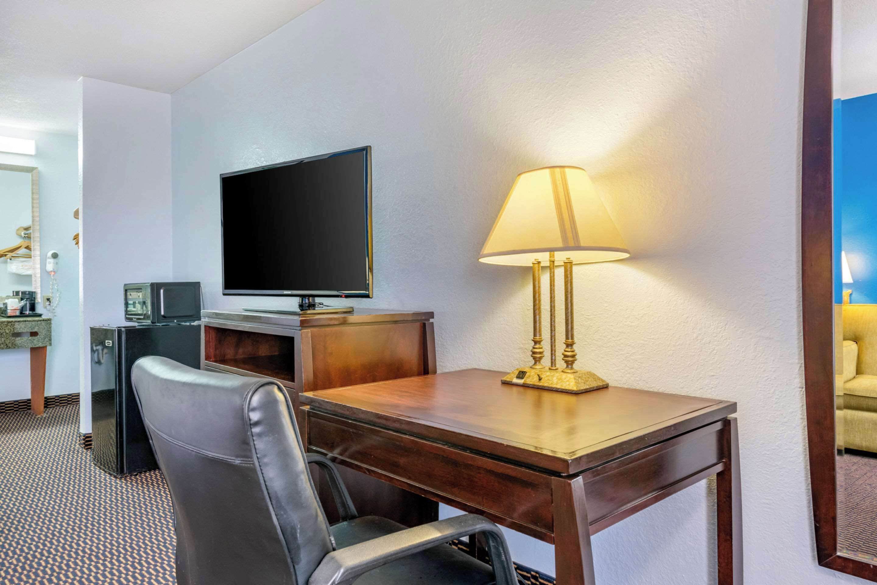 suite, 1 king bed, non smoking | desk, laptop workspace, blackout curtains, iron/ironing board