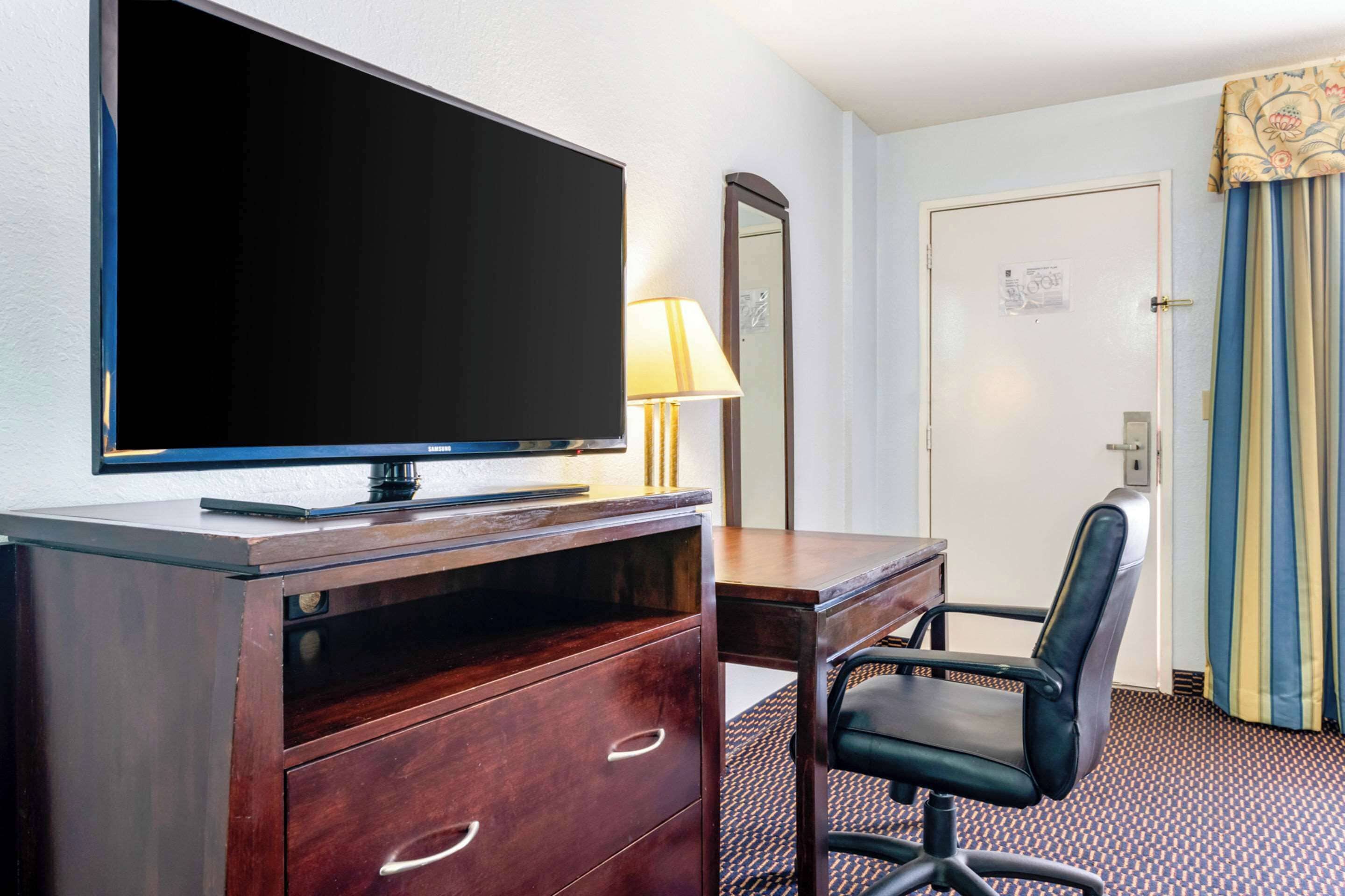 suite, 1 king bed, non smoking | desk, laptop workspace, blackout curtains, iron/ironing board