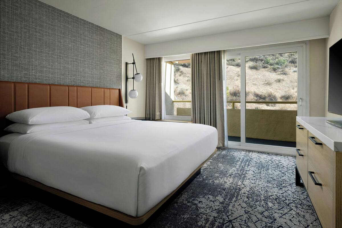 Premium bedding, down comforters, in-room safe, desk