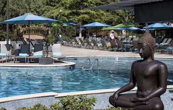 Indoor pool, seasonal outdoor pool, cabanas (surcharge), pool umbrellas at  Hilton Anatole