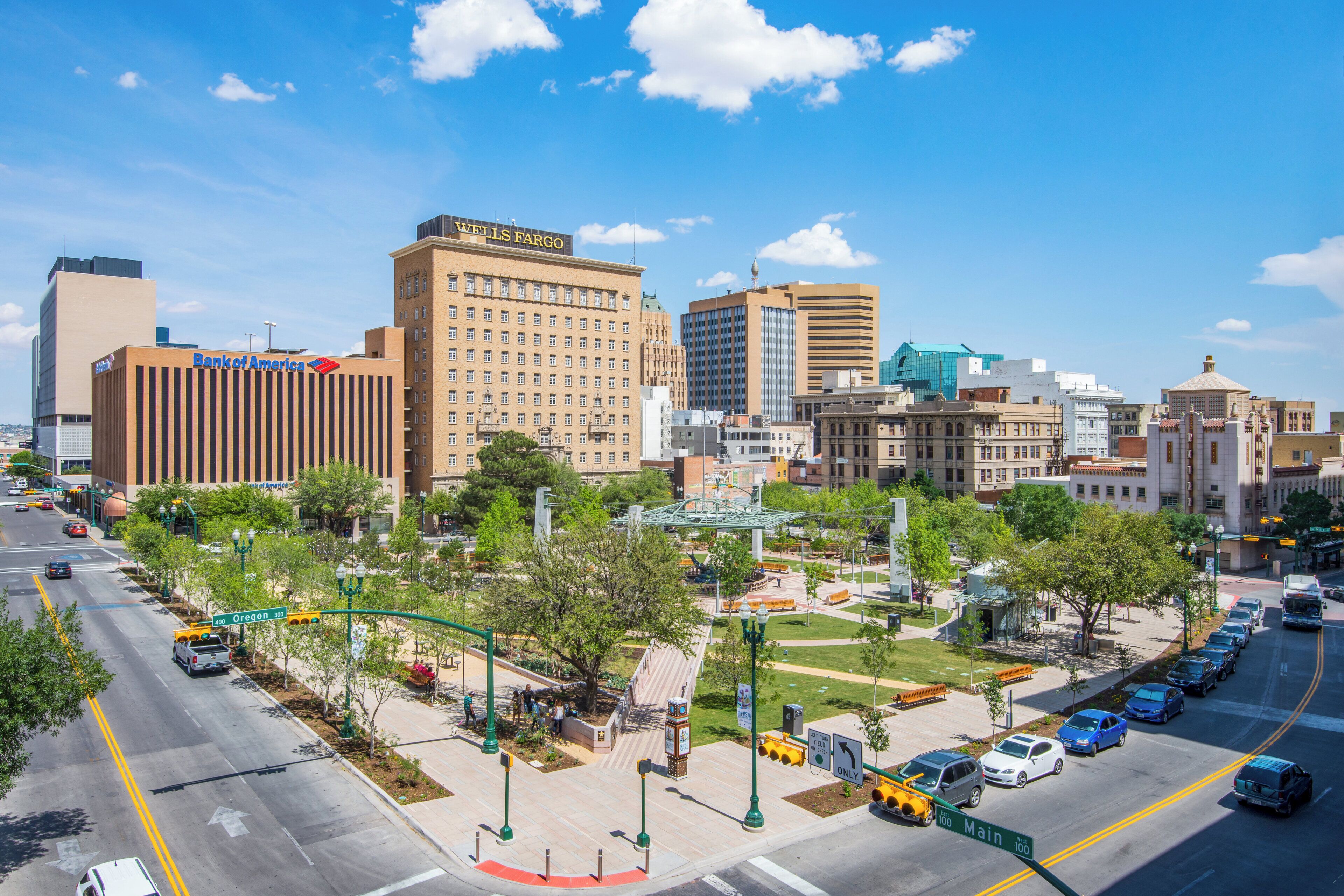 A cityscape with prominent buildings including a Wells Fargo and Bank of America.
