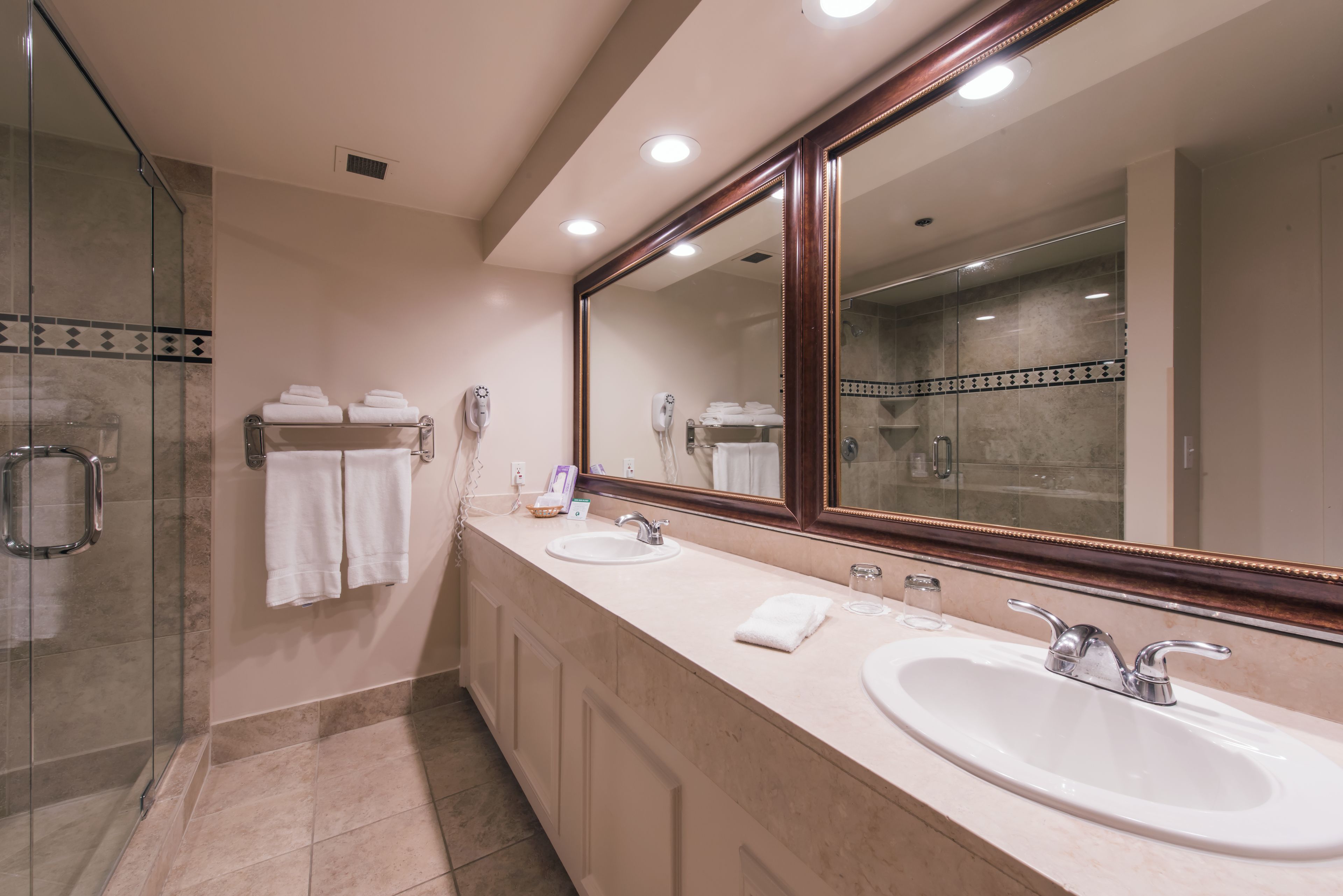 executive suite, 1 king bed | bathroom | combined shower/bathtub, designer toiletries, hair dryer, towels